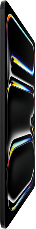 Un iPad Pro color nero siderale visto di fronte, guscio in alluminio e vetro, profilo sottile, inclinato all’indietro con il display che mostra un motivo a linee multicolori